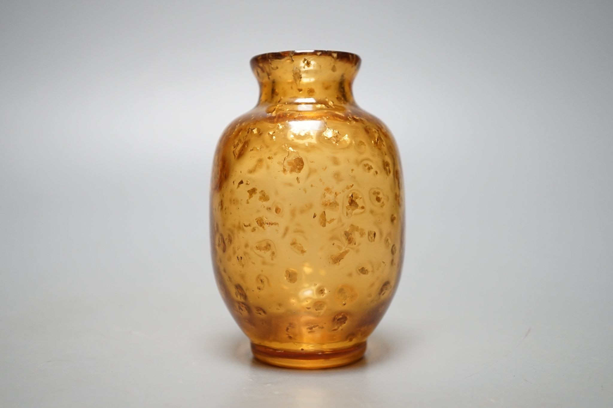 A Chinese gilt included amber glass vase., 9 cms high.